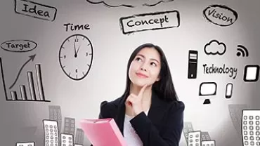 Person thinking about success with drawings of ideas and technology.