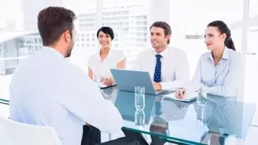 Group of people in discussion during a business meeting.