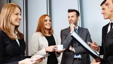 Group of people talking during a business meeting.