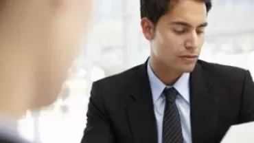 Two people engaged in a business meeting.