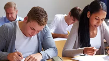 Students taking a test in a classroom.
