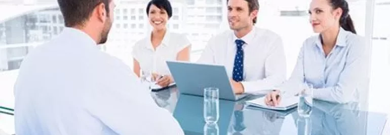 Group of people in discussion during a business meeting.
