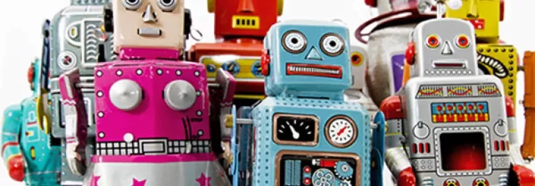 A collection of colorful vintage toy robots.