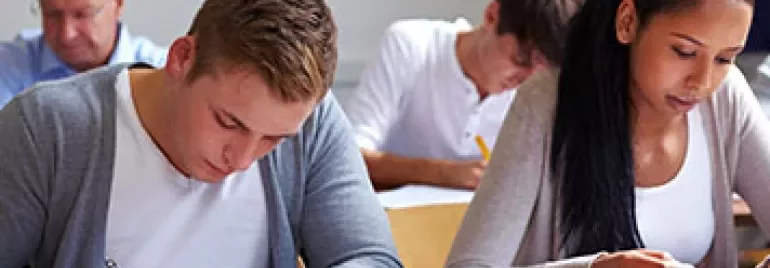 Students taking a test in a classroom.